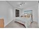 Comfortable bedroom featuring a cozy bed, soft lighting, and a black shuttered window at 6970 Piazza St, Orlando, FL 32819