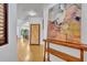 Inviting hallway with hardwood floors and stylish decor leading into dining area at 6970 Piazza St, Orlando, FL 32819