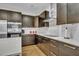 Beautiful kitchen featuring modern appliances, sleek countertops, and stylish tile backsplash at 6970 Piazza St, Orlando, FL 32819