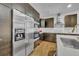 Modern kitchen featuring stainless steel appliances and a sleek countertop at 6970 Piazza St, Orlando, FL 32819