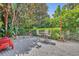 Charming patio area with brick pavers, bistro seating, and lush landscaping, great for outdoor entertaining at 6970 Piazza St, Orlando, FL 32819