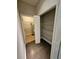 Walk-in closet with shelves, a water heater, and access to storage space at 7673 Ripplepointe Way, Windermere, FL 34786