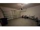 Spacious garage with an automatic door, offering ample space for parking and storage at 7673 Ripplepointe Way, Windermere, FL 34786
