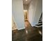 Hallway with access to closet, stairs, and other rooms, showcasing hardwood flooring at 7673 Ripplepointe Way, Windermere, FL 34786