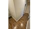 Hallway showing wood floors and entryways to other rooms in the home at 7673 Ripplepointe Way, Windermere, FL 34786