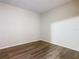 Bedroom showcasing the new wood-look flooring and neutral paint at 7865 Sugar View Ct # 7865, Orlando, FL 32819