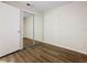 Bedroom featuring updated flooring and closet with mirrored sliding doors at 7865 Sugar View Ct # 7865, Orlando, FL 32819