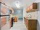 Bright kitchen showcasing granite countertops, stainless steel appliances, and an open layout at 7865 Sugar View Ct # 7865, Orlando, FL 32819