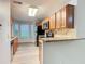 Well-lit kitchen featuring wood cabinets, granite countertops, stainless steel appliances, and an adjacent breakfast nook at 7865 Sugar View Ct # 7865, Orlando, FL 32819