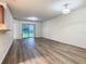 Spacious living room featuring light-colored flooring with an adjacent kitchen at 7865 Sugar View Ct # 7865, Orlando, FL 32819