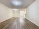 Large, empty living room with light-colored flooring and neutral paint at 7865 Sugar View Ct # 7865, Orlando, FL 32819