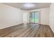Living room featuring stylish flooring and sliding glass doors to the outdoor patio at 7865 Sugar View Ct # 7865, Orlando, FL 32819