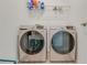 Laundry room with a full-size washer and dryer set on a gray tile floor at 824 Ofanto Way, Haines City, FL 33844