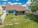 Backyard featuring a patio area perfect for relaxation, complemented by a well-maintained lawn at 8322 Cascade Oaks Dr, Orlando, FL 32822