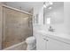 This bathroom features a walk-in shower with glass doors, a vanity, and modern fixtures at 8322 Cascade Oaks Dr, Orlando, FL 32822