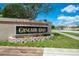 Entrance sign for Cascade Oaks community showcasing well-maintained landscaping and inviting atmosphere at 8322 Cascade Oaks Dr, Orlando, FL 32822