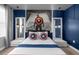 Spacious bedroom decorated with Captain America themed pillows and accents at 9020 Stinger Dr, Davenport, FL 33896