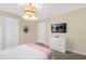 Cozy bedroom with a TV, a dresser, and soft lighting, creating a relaxing space at 9020 Stinger Dr, Davenport, FL 33896