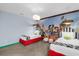 Bedroom with a Toy Story mural, cloud light, and plush sheep stools at 9020 Stinger Dr, Davenport, FL 33896