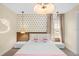 Charming bedroom featuring a Hello Kitty themed decor with a cute neon light at 9020 Stinger Dr, Davenport, FL 33896