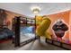 ' room with unique bunk beds, a slide, ball pit, and Kung Fu Panda themed wallpaper at 9020 Stinger Dr, Davenport, FL 33896