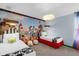 Colorful bedroom with a Toy Story mural and playful decor at 9020 Stinger Dr, Davenport, FL 33896
