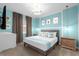 Stylish bedroom with a queen bed, modern furniture, and trendy decor at 9020 Stinger Dr, Davenport, FL 33896