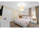 Whimsical bedroom with Hello Kitty accents, soft lighting, and cute decor at 9020 Stinger Dr, Davenport, FL 33896
