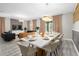 Open concept dining and living area with stylish furnishings and decor at 9020 Stinger Dr, Davenport, FL 33896