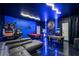 Unique basement game room with a pool table, foosball table, vintage arcade games, and creative decor at 9020 Stinger Dr, Davenport, FL 33896