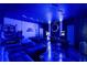 Unique game room featuring a pool table, foosball, arcade games, and sleek modern lighting at 9020 Stinger Dr, Davenport, FL 33896