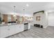 Bright and spacious kitchen with a view into the living and dining areas at 9020 Stinger Dr, Davenport, FL 33896