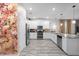 Modern kitchen with white cabinets, stainless steel appliances, and granite countertops at 9020 Stinger Dr, Davenport, FL 33896