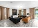 Stylish living room with modern furniture, elegant curtains, and lots of natural light at 9020 Stinger Dr, Davenport, FL 33896