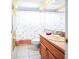 Full bathroom featuring a vanity with storage and a shower with a patterned curtain at 952 Chamberlin Trl, St Cloud, FL 34772