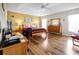 Bedroom featuring hard wood floors, ceiling fan, and a comfortable layout with ample natural light at 952 Chamberlin Trl, St Cloud, FL 34772