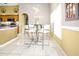 Bright dining area adjacent to kitchen with modern table and seating and natural light at 952 Chamberlin Trl, St Cloud, FL 34772