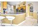 Bright kitchen with tile floor, granite countertops, stainless steel appliances, and ample counter seating at 952 Chamberlin Trl, St Cloud, FL 34772