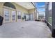 Spacious screened patio featuring a tiled floor, offering a versatile outdoor living and entertainment space at 952 Chamberlin Trl, St Cloud, FL 34772