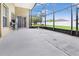 Large screened-in patio offers ample space for outdoor seating and entertaining with backyard views at 952 Chamberlin Trl, St Cloud, FL 34772
