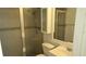 Functional bathroom with glass enclosed shower, toilet and a vanity offering a clean and well-maintained space at 9916 Sweepstakes Ln # 7, Orlando, FL 32837