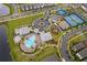 Aerial view of community amenities featuring a pool, clubhouse, playground, tennis and basketball courts at 10364 Shive Island Ct, Orlando, FL 32827