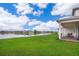 Backyard patio seating area that overlooks a serene lake at 10364 Shive Island Ct, Orlando, FL 32827