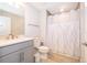 Cozy bathroom featuring a single vanity with neutral countertops and a shower-tub combination at 10364 Shive Island Ct, Orlando, FL 32827