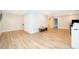 Open bonus room with light wood flooring and a cozy seating area at 10364 Shive Island Ct, Orlando, FL 32827