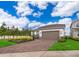 Charming single-Gathering home boasts a well-manicured lawn, lush landscaping, and an attached two-car garage at 10364 Shive Island Ct, Orlando, FL 32827