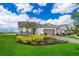 Charming single-Gathering home boasts a well-manicured lawn, lush landscaping, and an attached two-car garage at 10364 Shive Island Ct, Orlando, FL 32827