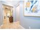 Light filled hallway featuring wood-look tile flooring and decorative accents at 10364 Shive Island Ct, Orlando, FL 32827