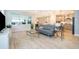 Open-concept living room with modern finishes, natural light, and backyard views at 10364 Shive Island Ct, Orlando, FL 32827