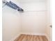 Empty walk-in closet with wooden floors and wire shelving at 10364 Shive Island Ct, Orlando, FL 32827